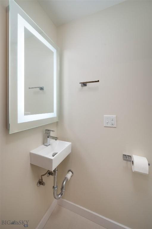 476 Enterprise Blvd Unit 207, Bozeman, MT 59718 - bathroom with baseboards and a sink
