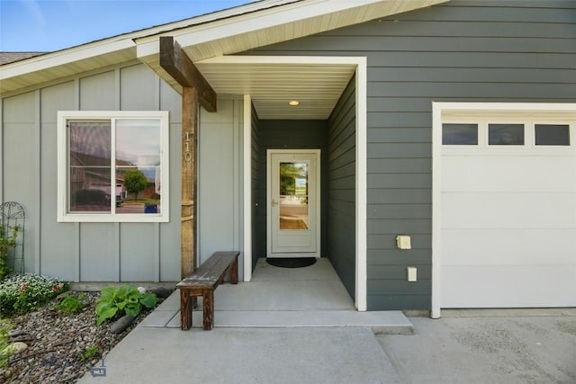 110 Ramshorn Peak Ln, Bozeman, MT 59718 - doorway to property featuring board and batten siding and an attached garage