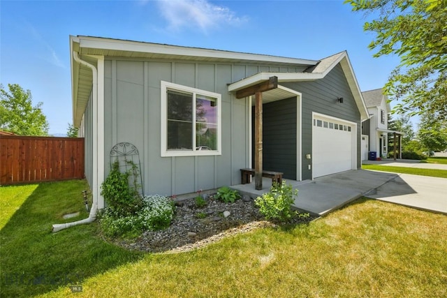 110 Ramshorn Peak Ln, Bozeman, MT 59718 - view of side of property featuring board and batten siding, driveway, and a garage