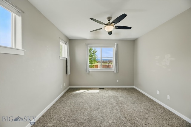 110 Ramshorn Peak Ln, Bozeman, MT 59718 - spare room featuring ceiling fan, carpet floors, and baseboards