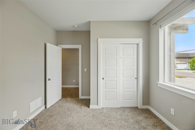 110 Ramshorn Peak Ln, Bozeman, MT 59718 - unfurnished bedroom with carpet floors, a closet, and baseboards