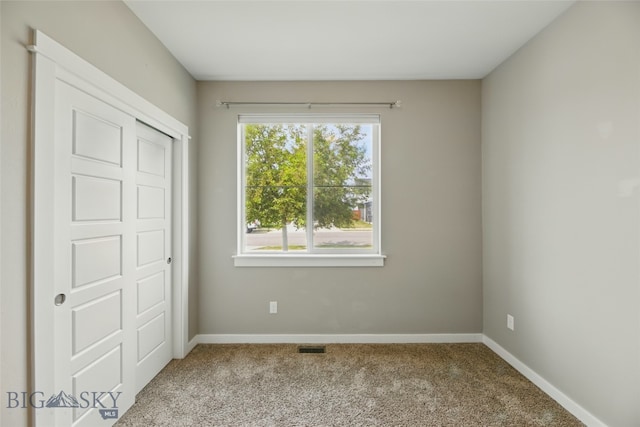 110 Ramshorn Peak Ln, Bozeman, MT 59718 - unfurnished bedroom featuring carpet flooring, baseboards, and a closet