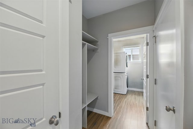 110 Ramshorn Peak Ln, Bozeman, MT 59718 - walk in closet with stacked washer / drying machine and wood finished floors