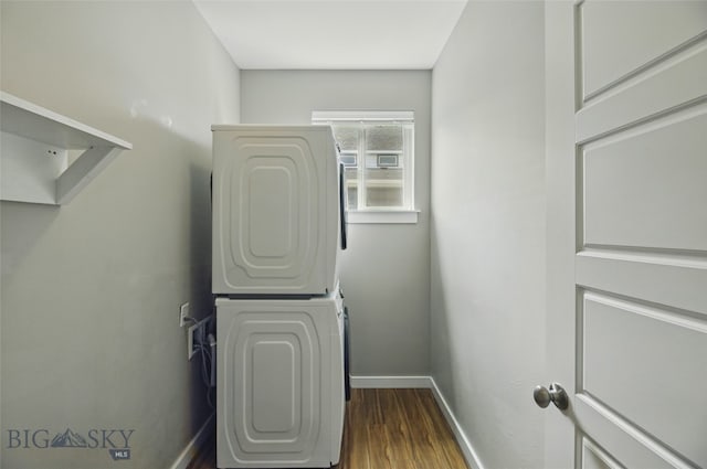 110 Ramshorn Peak Ln, Bozeman, MT 59718 - washroom featuring estacked washer and dryer, baseboards, and dark wood-type flooring