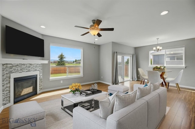 110 Ramshorn Peak Ln, Bozeman, MT 59718 - living room featuring healthy amount of natural light, baseboards, wood finished floors, ceiling fan, and recessed lighting