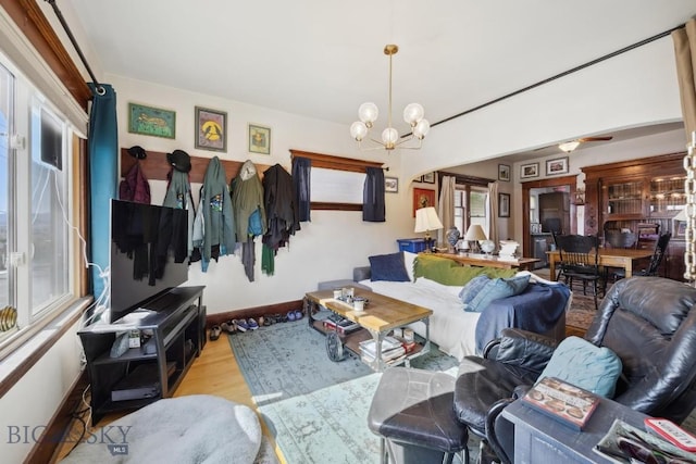 521 S Washington, Butte, MT 59701 - living area with wood finished floors, a chandelier, and baseboards