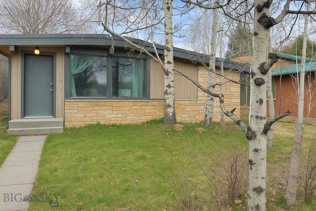1109 S Willson, Bozeman, MT 59715 - view of home's exterior with stone siding and a lawn