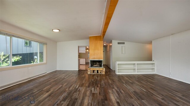 1109 S Willson, Bozeman, MT 59715 - unfurnished living room featuring wood finished floors, a baseboard radiator, vaulted ceiling, a fireplace, and baseboards