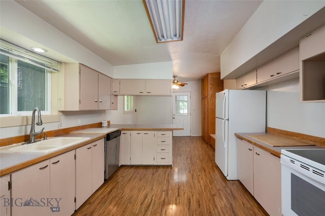 1109 S Willson, Bozeman, MT 59715 - kitchen with a sink, white appliances, light wood-style flooring, a peninsula, and light countertops