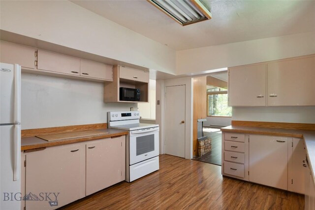 1109 S Willson, Bozeman, MT 59715 - kitchen featuring white appliances, wood finished floors, and light countertops