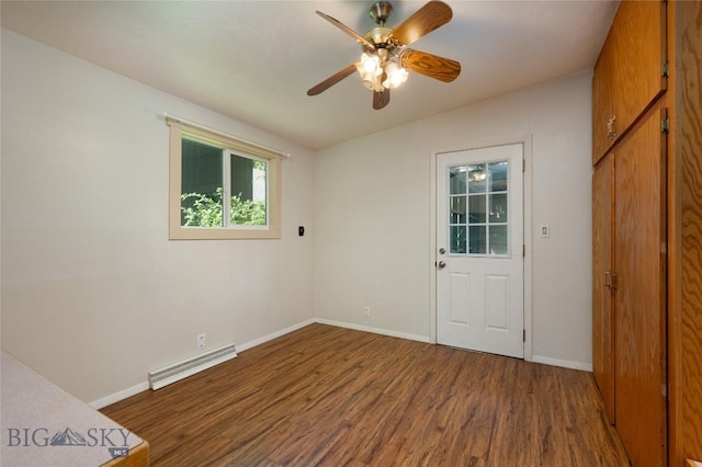 1109 S Willson, Bozeman, MT 59715 - spare room with a baseboard radiator, wood finished floors, baseboards, and ceiling fan