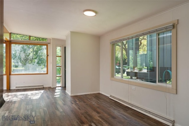 1109 S Willson, Bozeman, MT 59715 - empty room with a baseboard radiator, wood finished floors, baseboards, and crown molding