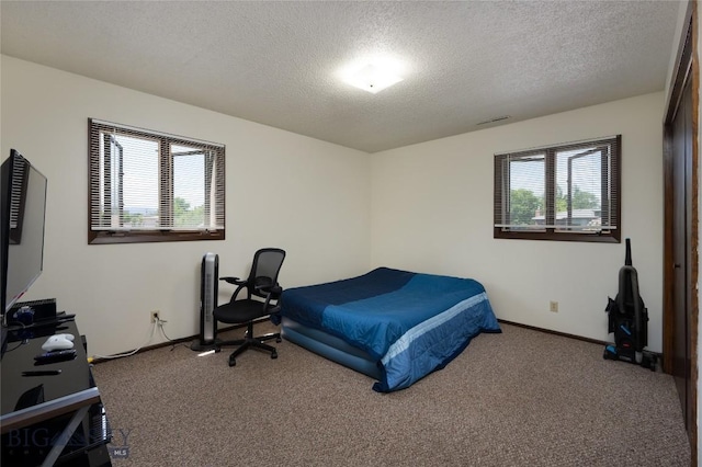 405 N 16th, Bozeman, MT 59715 - carpeted bedroom featuring a textured ceiling and baseboards