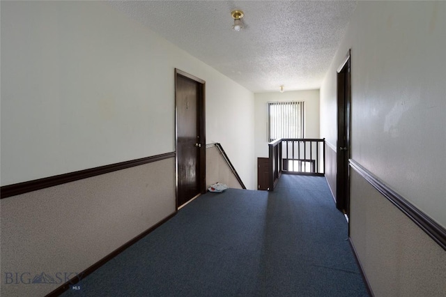 405 N 16th, Bozeman, MT 59715 - hall featuring an upstairs landing, a textured ceiling, and carpet