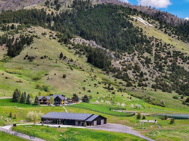 354 Brass Lantern Ct, Bozeman, MT 59715 - overview of rural landscape featuring a mountainous background and a heavily wooded area