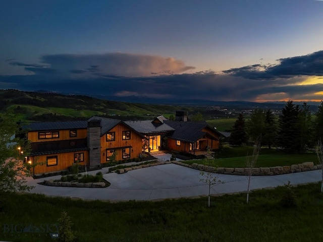 354 Brass Lantern Ct, Bozeman, MT 59715 - view of front of property featuring curved driveway and metal roof