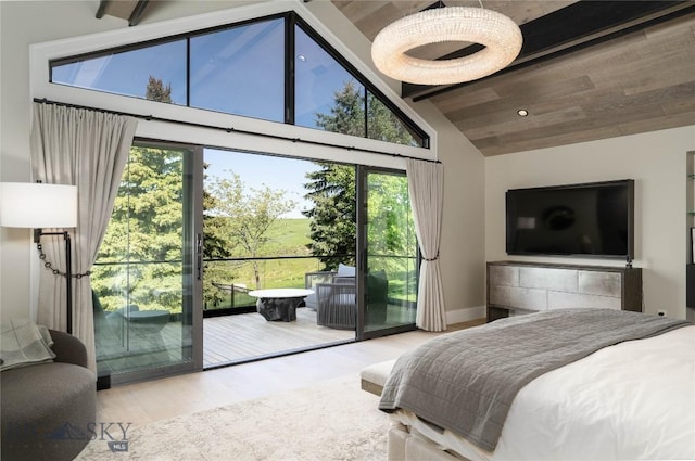 354 Brass Lantern Ct, Bozeman, MT 59715 - bedroom with access to exterior, high vaulted ceiling, wood finished floors, and beamed ceiling