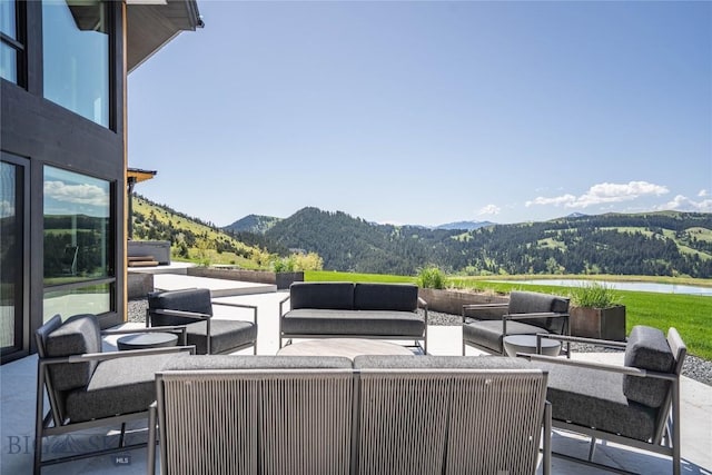 354 Brass Lantern Ct, Bozeman, MT 59715 - view of patio / terrace featuring a water and mountain view and an outdoor living space