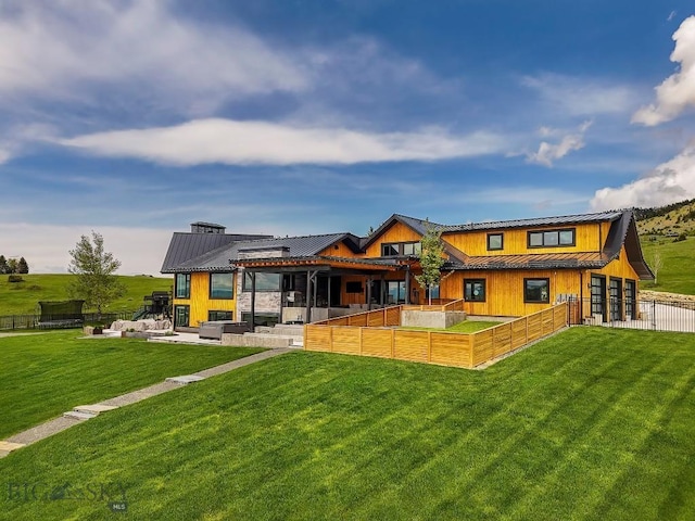 354 Brass Lantern Ct, Bozeman, MT 59715 - back of property featuring a standing seam roof, a patio, metal roof, and board and batten siding