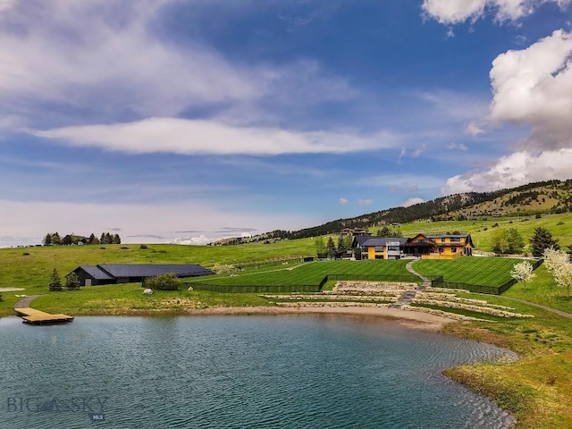 354 Brass Lantern Ct, Bozeman, MT 59715 - water view with a mountain backdrop and rural landscape