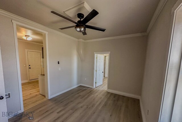 211 W Main St, East Helena, MT 59635 - spare room featuring wood finished floors, ornamental molding, and ceiling fan