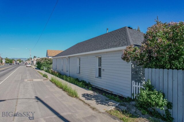 211 W Main St, East Helena, MT 59635 - view of asphalt road featuring street lights and sidewalks