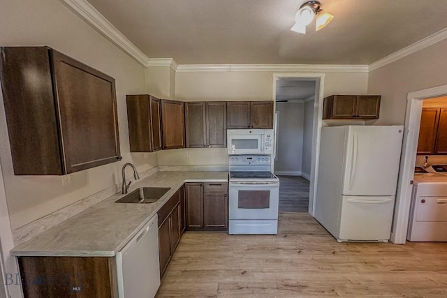 211 W Main St, East Helena, MT 59635 - kitchen featuring white appliances, washer / clothes dryer, ornamental molding, light wood-style floors, and dark brown cabinets