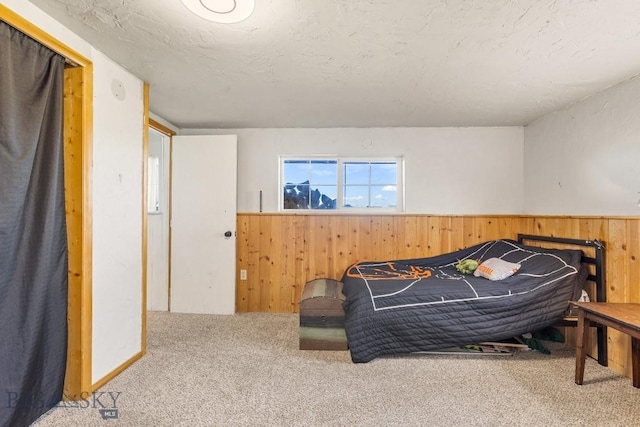 251 Price Rd, Three Forks, MT 59752 - bedroom with wooden walls, carpet, and a wainscoted wall