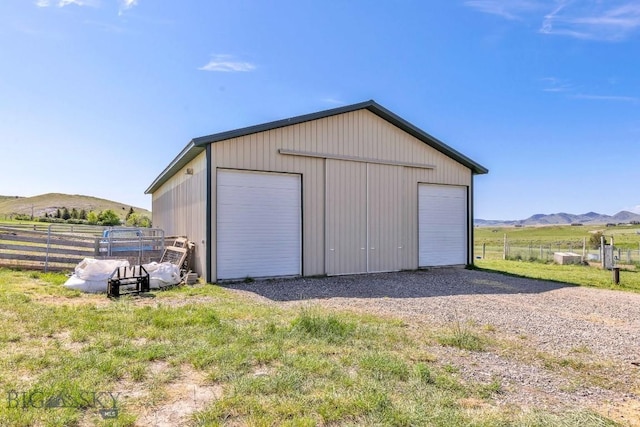 251 Price Rd, Three Forks, MT 59752 - detached garage featuring a mountain view and a rural view