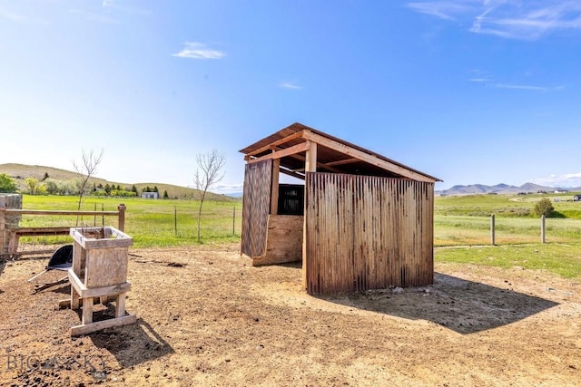251 Price Rd, Three Forks, MT 59752 - view of outdoor structure featuring a view of rural / pastoral area, a mountain view, and an exterior structure