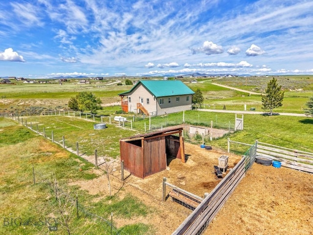251 Price Rd, Three Forks, MT 59752 - view of yard featuring a view of countryside, an exterior structure, and an outbuilding