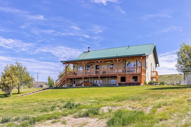 251 Price Rd, Three Forks, MT 59752 - back of property with a yard, metal roof, stairway, and a wooden deck