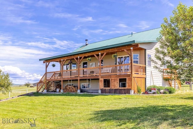 251 Price Rd, Three Forks, MT 59752 - rear view of property featuring stairway, a yard, and metal roof