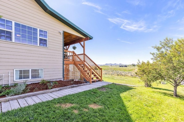 251 Price Rd, Three Forks, MT 59752 - view of grassy yard featuring stairs and a mountain view