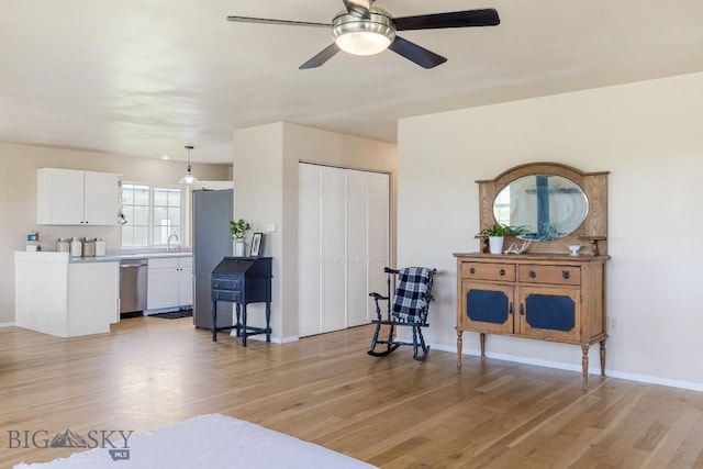 251 Price Rd, Three Forks, MT 59752 - sitting room with ceiling fan, light wood-style flooring, and baseboards