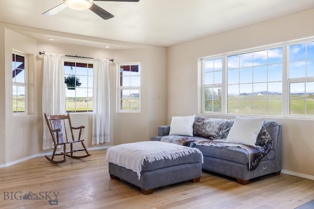 251 Price Rd, Three Forks, MT 59752 - living room featuring light wood-type flooring, baseboards, and ceiling fan