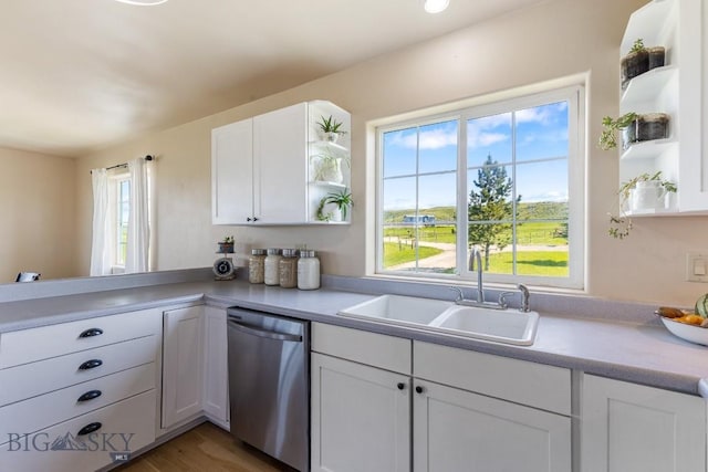 251 Price Rd, Three Forks, MT 59752 - kitchen with open shelves, dishwasher, white cabinetry, light countertops, and a sink