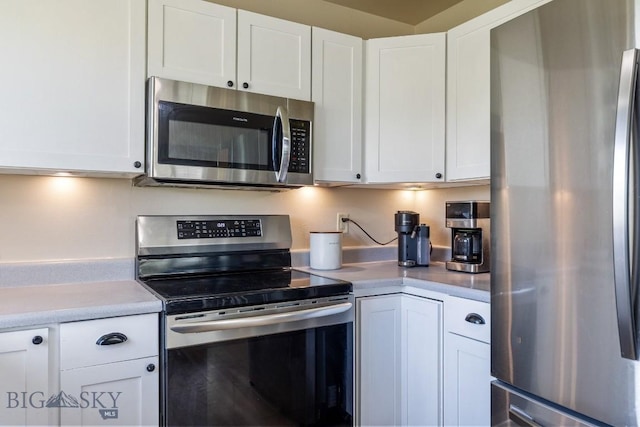 251 Price Rd, Three Forks, MT 59752 - kitchen featuring stainless steel appliances, white cabinetry, and light countertops