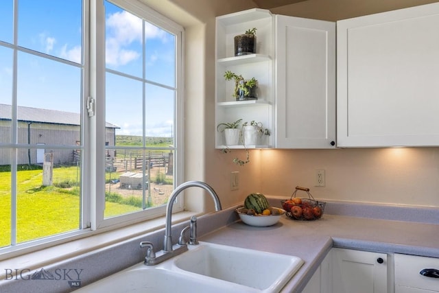 251 Price Rd, Three Forks, MT 59752 - kitchen with white cabinets, open shelves, and light countertops