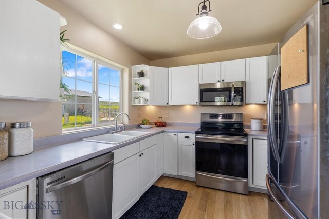 251 Price Rd, Three Forks, MT 59752 - kitchen featuring appliances with stainless steel finishes, a sink, light countertops, white cabinets, and recessed lighting