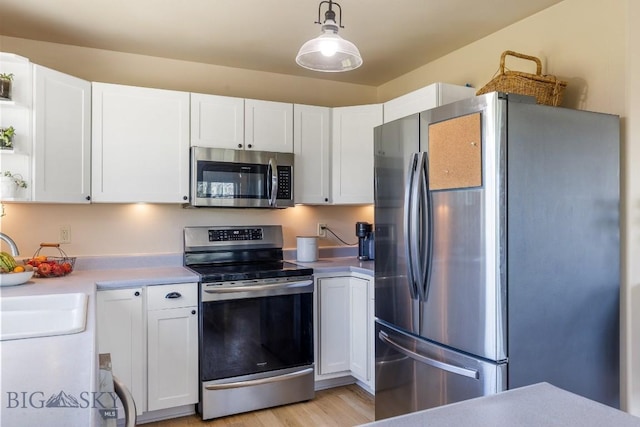 251 Price Rd, Three Forks, MT 59752 - kitchen featuring stainless steel appliances, white cabinetry, and light countertops