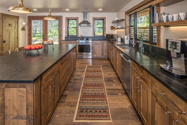 TBD Buttermilk Court, West Yellowstone, MT 59758 - kitchen with stainless steel appliances, wall chimney range hood, open shelves, dark wood-style flooring, and a sink