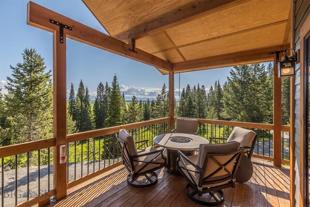 TBD Buttermilk Court, West Yellowstone, MT 59758 - deck with a fire pit and a view of trees