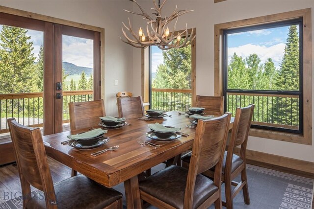 TBD Buttermilk Court, West Yellowstone, MT 59758 - dining area with a chandelier and plenty of natural light