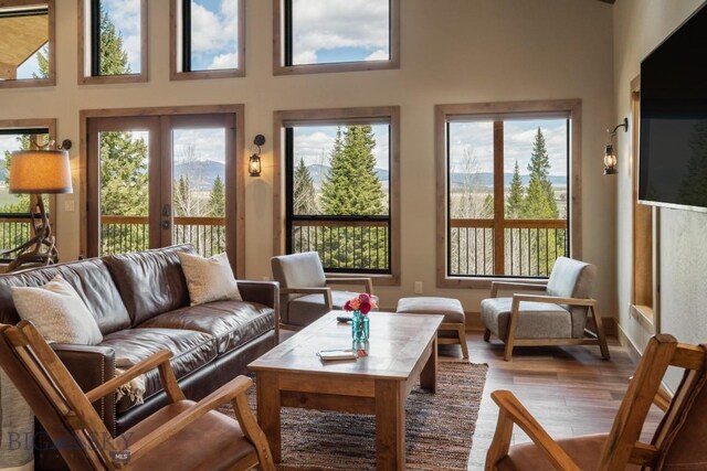 TBD Buttermilk Court, West Yellowstone, MT 59758 - living area with wood finished floors, french doors, and a towering ceiling