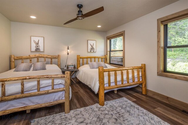 TBD Buttermilk Court, West Yellowstone, MT 59758 - bedroom with multiple windows, wood finished floors, recessed lighting, and baseboards