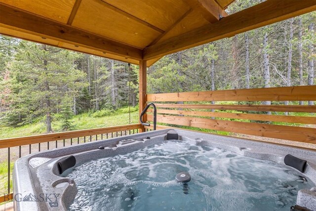 TBD Buttermilk Court, West Yellowstone, MT 59758 - deck with a hot tub and a forest view