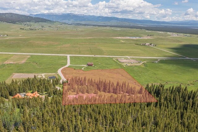 TBD Buttermilk Court, West Yellowstone, MT 59758 - aerial overview of property's location with mountains and rural landscape