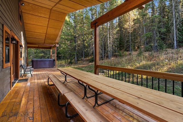 TBD Buttermilk Court, West Yellowstone, MT 59758 - wooden terrace featuring a hot tub and a wooded view