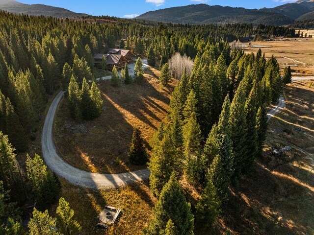 TBD Buttermilk Court, West Yellowstone, MT 59758 - aerial overview of property's location featuring a mountainous background and a heavily wooded area